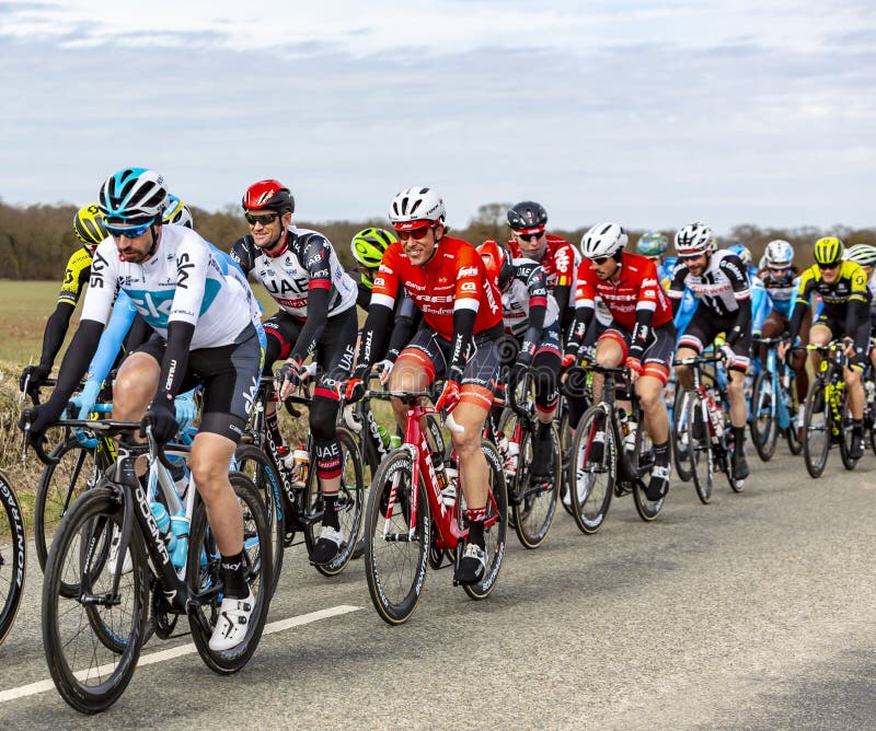 Fains-la-Folie, France - March 5, 2018: The Dutch cyclist Koen de Kort of Trek-Segafredo Team riding in the peloton on a country road during the stage 2 of Paris-Nice 2018. Fains-la-Folie, France - March 5, 2018: The Dutch cyclist Koen de Kort of Trek-Segafredo Team riding in the peloton on a country road during the stage 2 of Paris-Nice 2018